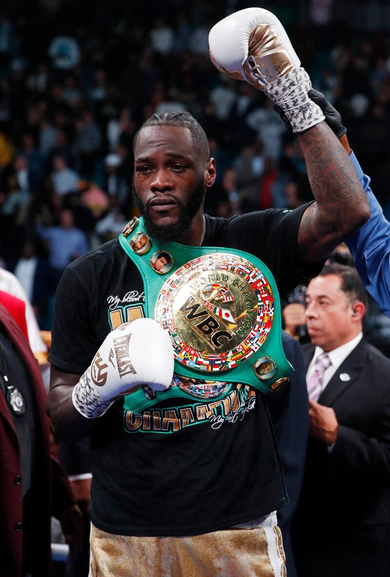 Deontay Wilder poses after defeating Luis Ortiz in the WBC heavyweight title boxing match. AP