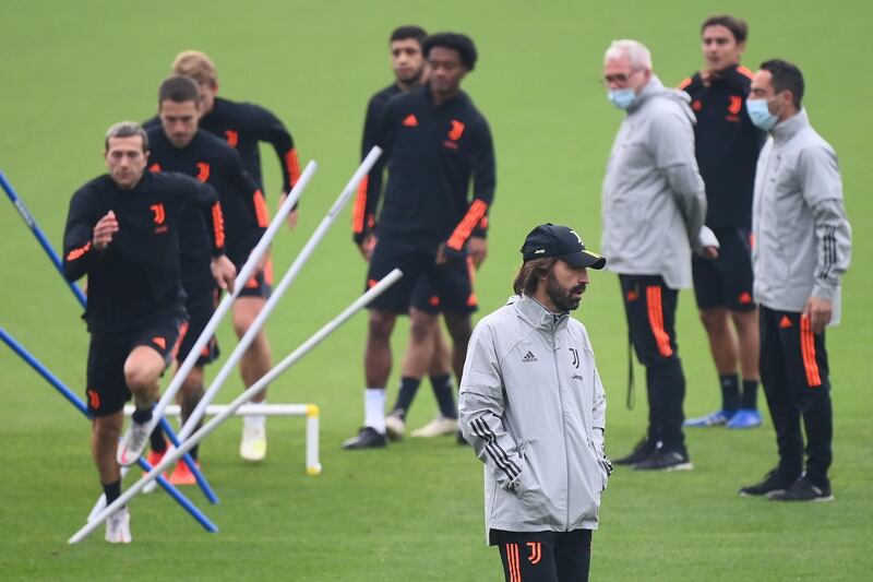 Juventus' coach Andrea Pirlo watches over a training session,at the Juventus Training Center in Turin, on the eve of the Uefa Champions League match against Dynamo Kiev. AFP