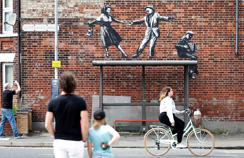This artwork depicting people dancing above a bus stop in Great Yarmouth is already attracting the attention of passers-by.