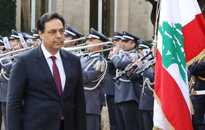 A handout picture provided by the Lebanese photo agency Dalati and Nohra on on January 22, 2020 shows Lebanon's new Prime Minister Hassan Diab (L) reviewing the honour guard upon his arrival at the presidential palace in Baabda, east of the capital Beirut, for the inaugural meeting for the newly formed government.  - === RESTRICTED TO EDITORIAL USE - MANDATORY CREDIT "AFP PHOTO / HO / DALATI AND NOHRA" - NO MARKETING - NO ADVERTISING CAMPAIGNS - DISTRIBUTED AS A SERVICE TO CLIENTS ===
 / AFP / DALATI AND NOHRA / - / === RESTRICTED TO EDITORIAL USE - MANDATORY CREDIT "AFP PHOTO / HO / DALATI AND NOHRA" - NO MARKETING - NO ADVERTISING CAMPAIGNS - DISTRIBUTED AS A SERVICE TO CLIENTS ===
