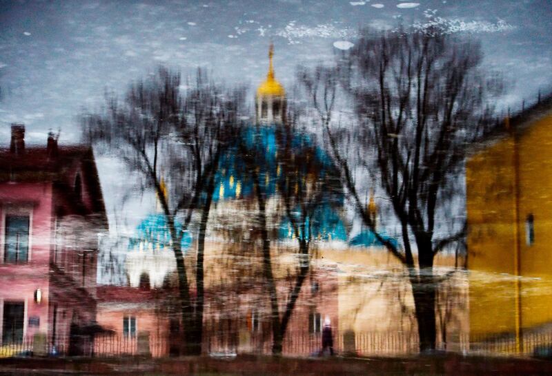 The Trinity Cathedral is reflected in the Fontanka River in Saint Petersburg, Russia. AFP