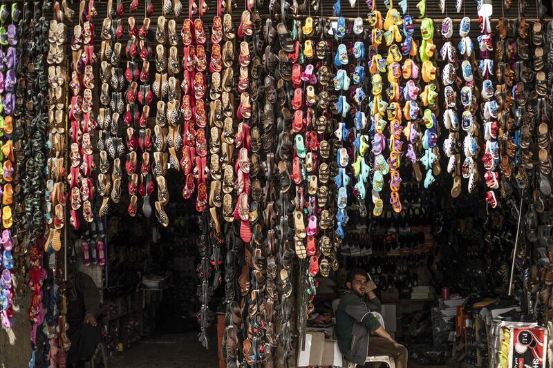 A shoe seller waits for customers in the northern Syrian city of Raqa. AFP