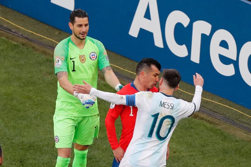Messi and Medel tussle off the ball in the incident that led to their red cards. AP Photo