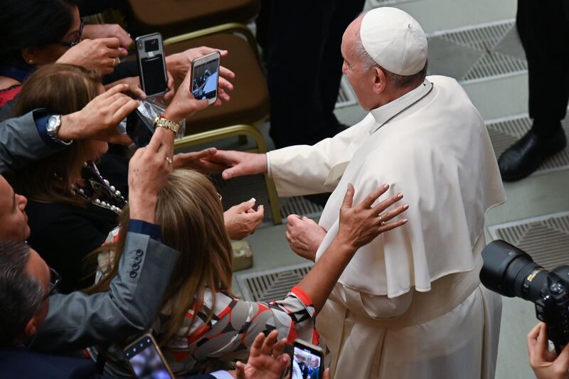 Pope Francis meets with worshipers during an audience at Paul-VI hall in the Vatican. AFP