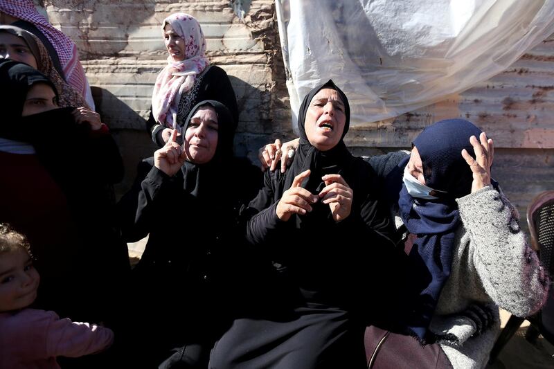 Relatives of three Palestinian fishermen from Allaham family mourn during their funeral in Khan Younis in the southern Gaza Strip. Reuters