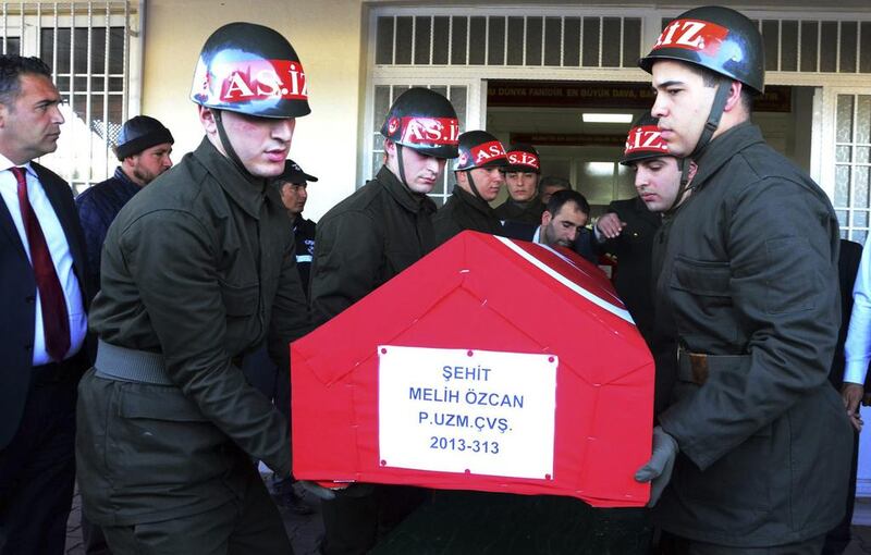 Soldiers carry the coffin of one of the Turkish soldiers killed in Syria at the airport in Gaziantep, Turkey, on November 24, 2016. AP Photo