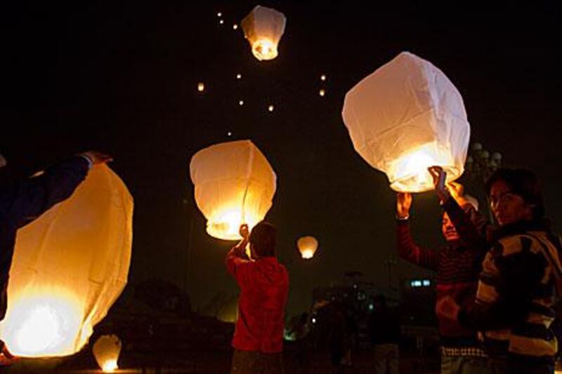 Supporters of the People's Youth Federation release lanterns to mark the fourth anniversary of the assassination of Benazir Bhutto in Islamabad yesterday.