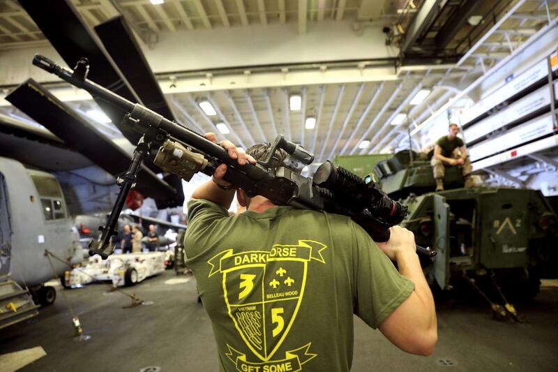 An US Marine carries his machine gun during a regular training.