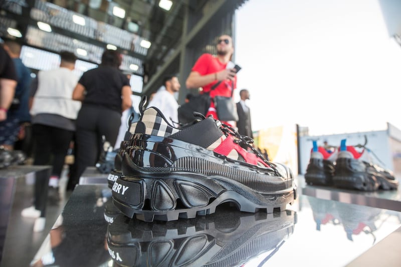 Dubai, United Arab Emirates- Visitors checking out shoes in one of the brand outlet at the Sole Dubai Festival at D3.  Leslie Pableo for The National for Saeed Saeed's story