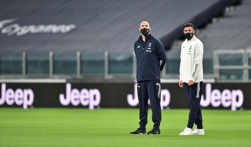Juventus staff out on the pitch prior to the match against Napoli. EPA