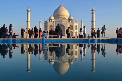 Tourists visit the Taj Mahal during early morning in Agra in February. AFP