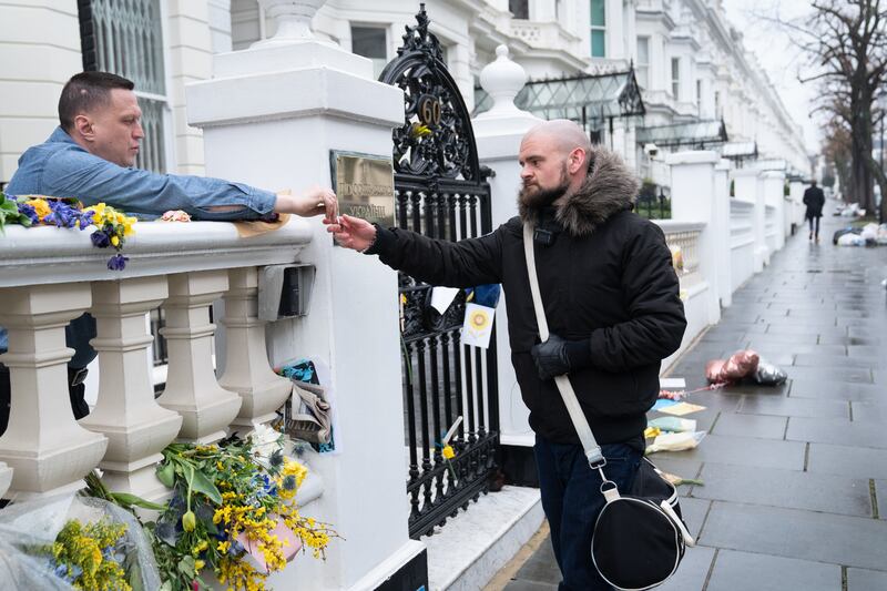 Alex Pickett from Andover in Hampshire receives advice from an embassy official as he attempts to sign up to join the Ukrainian armed forces at the Ukrainian Embassy in west London on Tuesday. PA