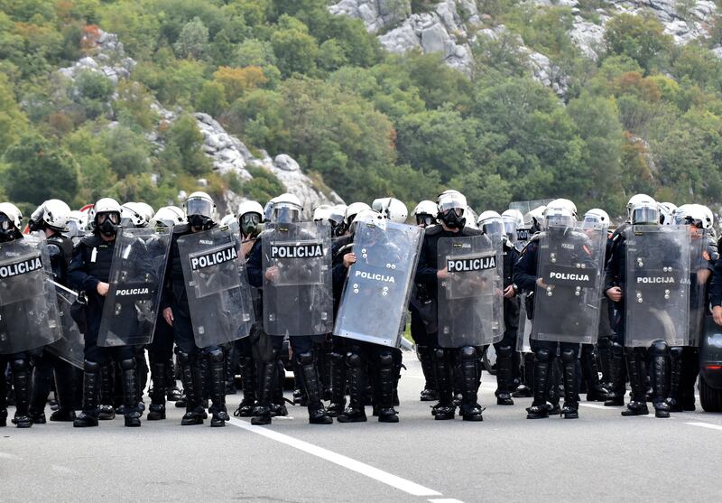 Montenegro riot police guard a road near Cetinje. AP Photo