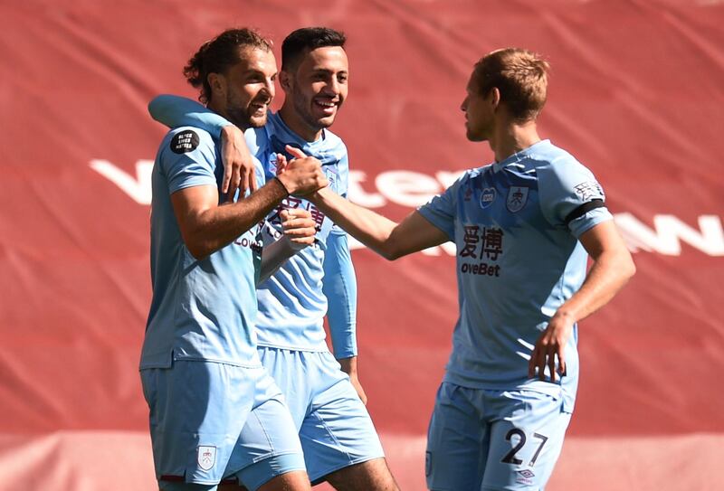 Burnley's Jay Rodriguez celebrates scoring their first goal with Dwight McNeil and Matej Vydra. Reuters