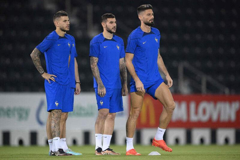 Lucas Hernandez, Theo Hernandez and Olivier Giroud take part in a training session at Al Janoub stadium in Doha, on November 21, 2022, on the eve of the Qatar 2022 World Cup football match against Australia. AFP