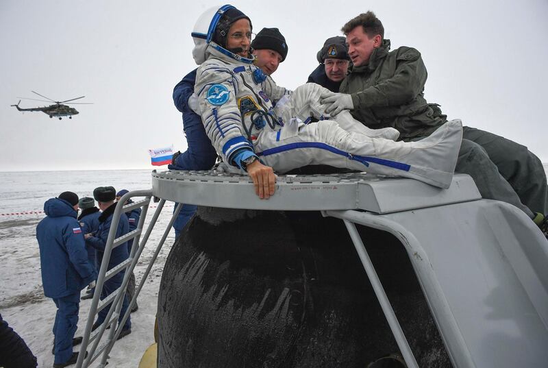 Ground personnel help NASA astronaut Joe Acaba to get out of the Soyuz MS-06 space capsule after landing in a remote area south-east of the Kazakh town of Zhezkazgan, Kazakhstan. Alexander Nemenov / Pool Photo via AP