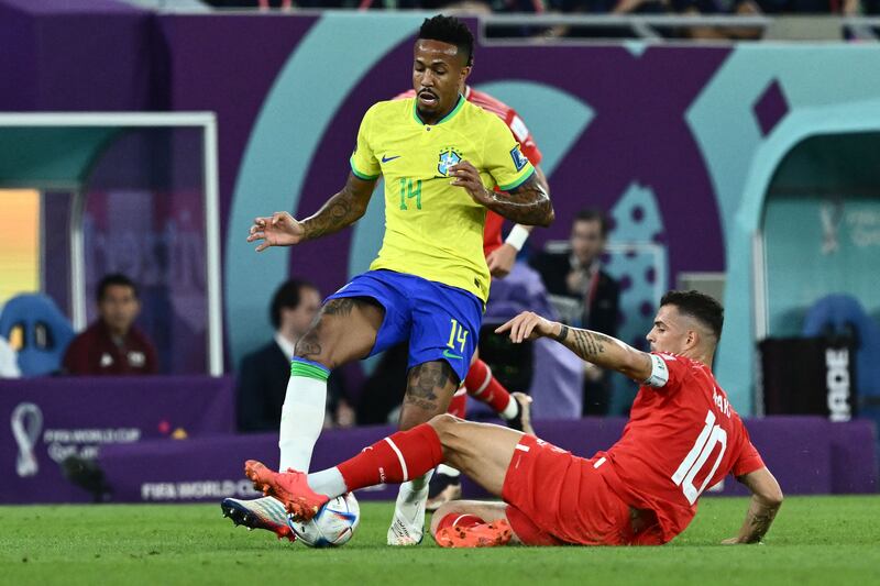 Switzerland's Granit Xhaka challenges Eder Militao of Brazil. AFP