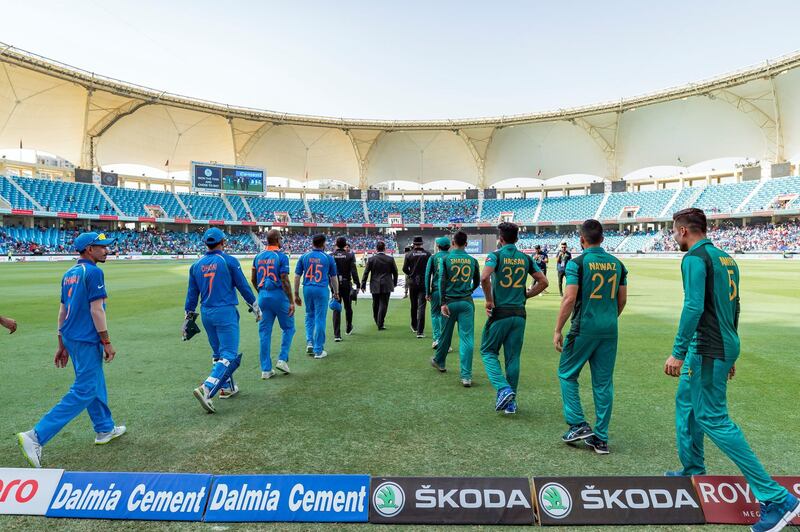 Dubai, United Arab Emirates - September 23, 2018: India and Pakistan go out onto the field during the game between India and Pakistan in the Asia cup. Sunday, September 23rd, 2018 at Sports City, Dubai. Chris Whiteoak / The National