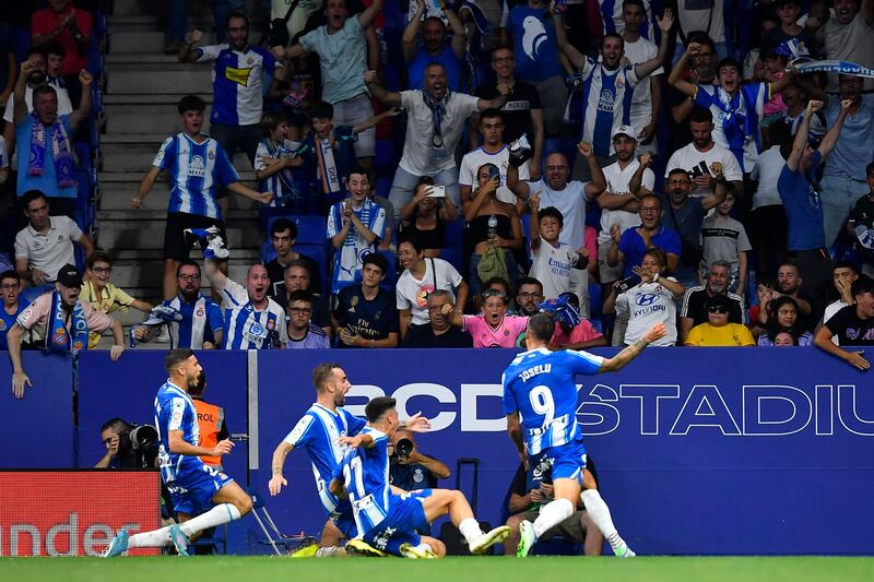 Joselu celebrates scoring Espanyol's first goal against Real Madrid. AFP