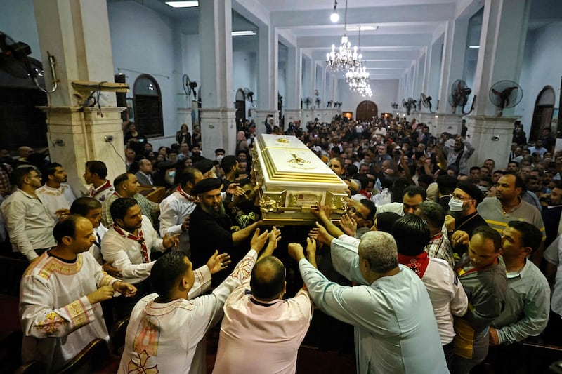 Egyptian mourners at a funeral of some of the 41 worshippers, many of them children, killed in Sunday's Abu Seifein church fire in Giza, greater Cairo. AFP