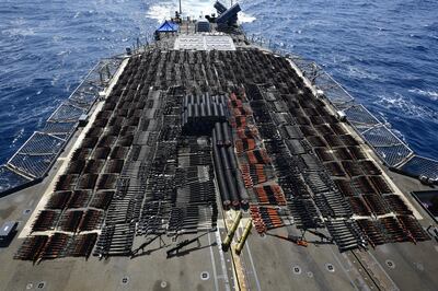 A photo by the US Navy showing the chache of weapons including dozens of advanced Russian-made anti-tank guided missiles, thousands of Chinese Type 56 assault rifles, and hundreds of PKM machine guns, sniper rifles and rocket-propelled grenades launchers. US Navy 