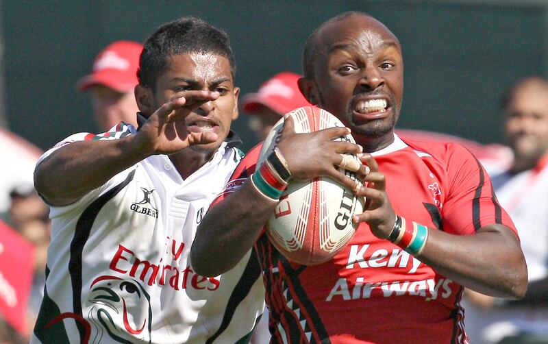 Dubai , United Arab Emirates, Dec 3 2011, UAE v Kenya , Sports Reporter Paul Radley  story- (left white kit) UAE's #10 Imad Reyal reaches for a (right) kenyan ball carrier  during action at the Emirates airlenes Dubai Rugby Sevens. Mike Young / The National
