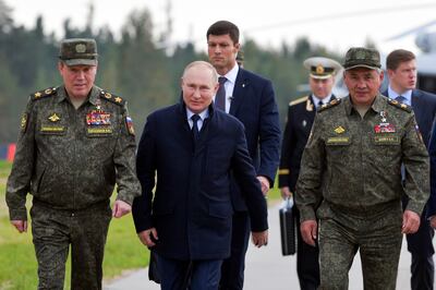 Russian President Vladimir Putin with Sergei Shoigu (R) and Valery Gerasimov (L) at armed forces drills in Nizhny Novgorod, Russia. AP Photo