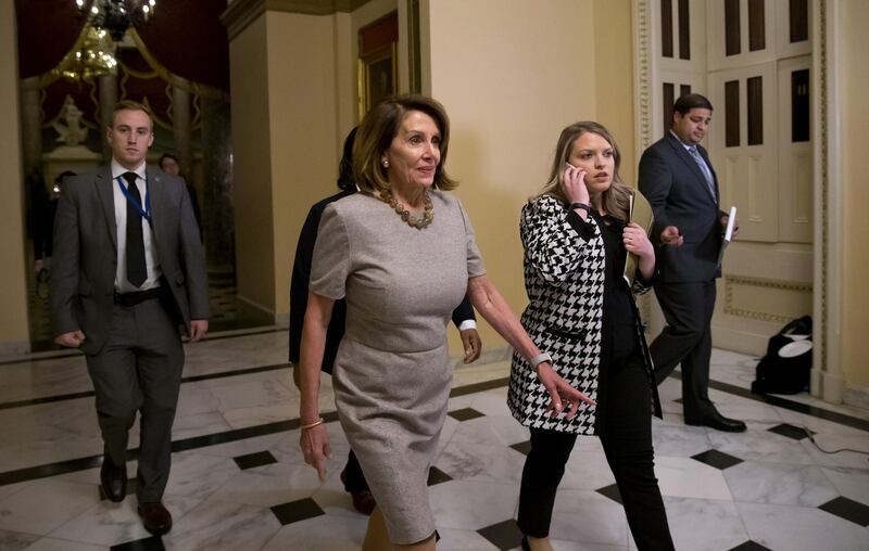 U.S. House Speaker Nancy Pelosi, a Democrat from California, walks to the House Chamber to sign a bill ending a partial government shutdown at the U.S. Capitol in Washington, D.C., U.S., on Friday, Jan. 25, 2019. Congress voted to end the 35-day partial government shutdown after President Donald Trump capitulated to Pelosi and agreed to reopen federal agencies without any guarantee of money for his proposed border wall. Photographer: Eric Thayer/Bloomberg