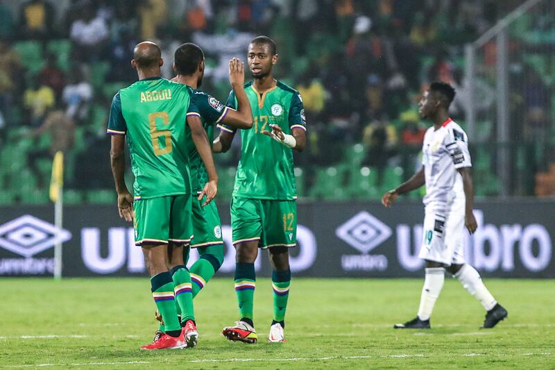 Comoros players celebrate after winning the match 3-2. AFP