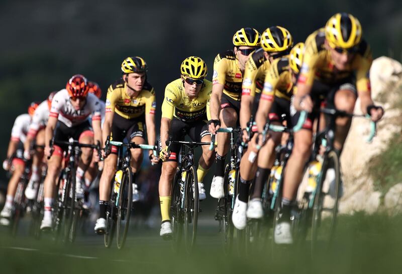 Race leader Primoz Roglic, centre, with his Jumbo-Visma teammates