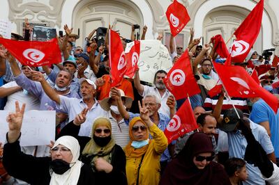 Opponents of Tunisia's President Kais Saied take part in a protest in Tunis on July 25. Reuters