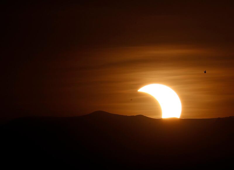 A view of the partial eclipse, in Sanaa, Yemen.  EPA