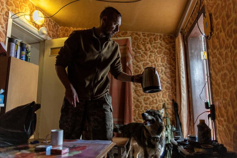 A Ukrainian soldier prepares coffee as he takes a break near an artillery position in the breakaway enclave of Donetsk, in the Donbas region. Reuters