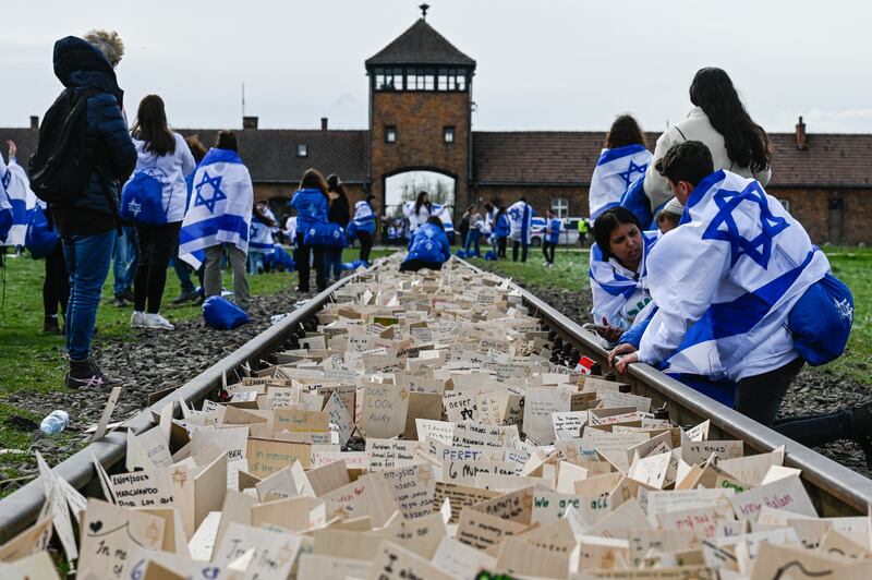 Train tracks into Auschwitz-Birkenau concentration camp, in Poland, are filled with written prayers and wishes for the March of the Living on April 18. Getty