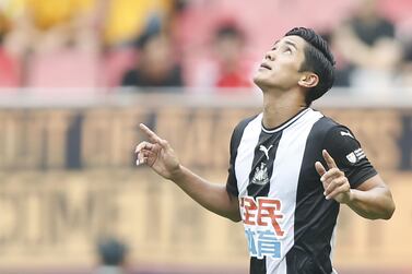 Yoshinori Muto celebrates after scoring for Newcastle against West Ham in the Premier League Asia Trophy. Getty Images