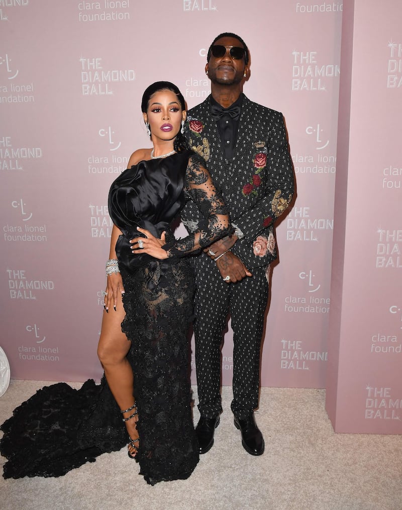 Jamaican model Keyshia Ka'Oir and American rapper Gucci Mane put a playful spin on their all-black ensembles, AFP