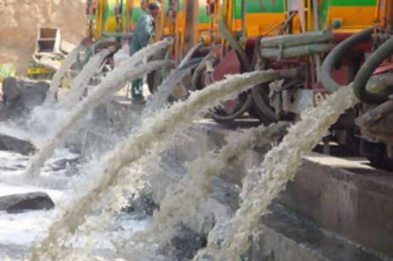 Sewage trucks being emptied at the musk lake.