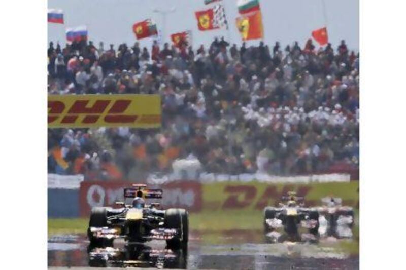 Sebastian Vettel leads the field past a packed grandstand. Attendance for the 2011 Turkish Grand Prix was better, thanks to improved access, but may not be enough to save the event for 2012. Frank Augstein / AP Photo