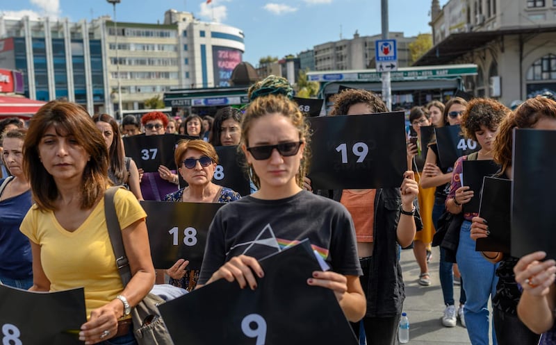 Women hold signs with different numbers symbolizing the women murders during a protest against gender violence in Istanbul, at Kadikoy on September 28, 2019.
 / AFP / BULENT KILIC
