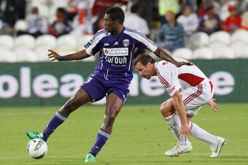 Asamoah Gyan, left, seen here in action against Al Jazira, struggled with injury during Al Ain’s victory against Emirates on Friday night.