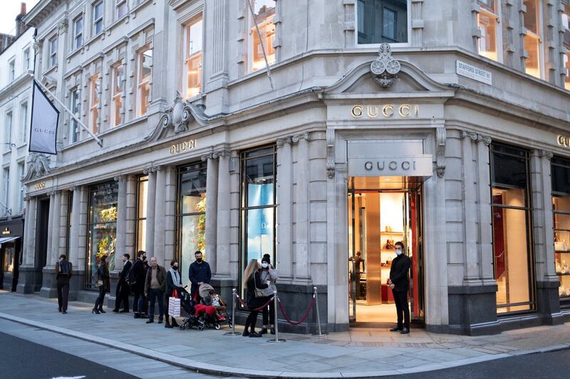 Shoppers queue outside Gucci shop on Bond Street as Londoners await the announcement of a second coronavirus lockdown it's business as usual in the West End with shoppers out and about and the pavements busy with people on what will be the last weekend before a month-long total lockdown in the UK on 31st October 2020 in London, United Kingdom. The three tier system in the UK has not worked sufficiently, to suppress the virus, and there have have been calls by politicians for a 'circuit breaker' complete lockdown to be announced to help the growing spread of the Covid-19. (photo by Mike Kemp/In Pictures via Getty Images)