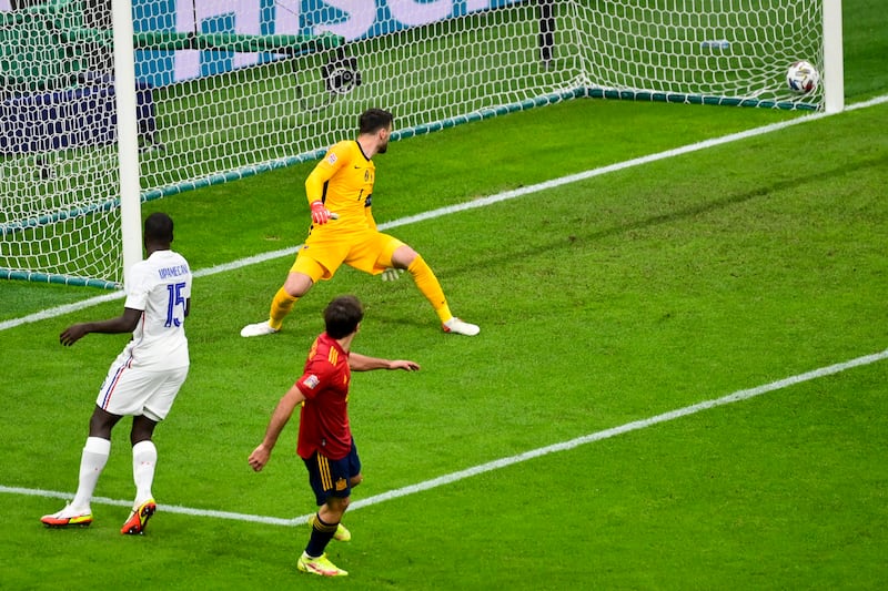 France's goalkeeper Hugo Lloris watches as Mikel Oyarzabal gives Spain the lead. AP