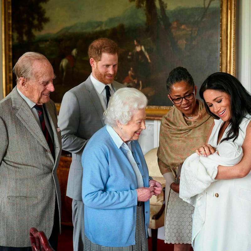 In this image provided by SussexRoyal, Britain's Prince Harry and Meghan, Duchess of Sussex, joined by her mother, Doria Ragland, show their new son to Queen Elizabeth II and Prince Philip at Windsor Castle, Windsor, England. Prince Harry and Meghan have named their son Archie Harrison Mountbatten-Windsor. (Chris Allerton/SussexRoyal via AP)