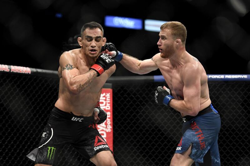 Justin Gaethje punches Tony Ferguson in their interim lightweight title fight during UFC 249. AFP