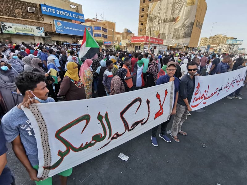 Sudanese anti-coup protesters gather in a street in Khartoum to express support for the country's democratic transition following the military takeover. AFP