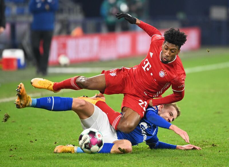 Bayern Munich's Kingsley Coman is challenged by Timo Becker of Schalke. Reuters