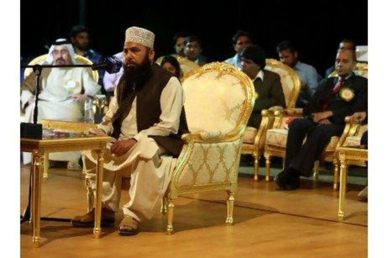 Dr Akram Shanzad, from Pakistan, reads his poetry at the mushaira in Abu Dhabi at the weekend.