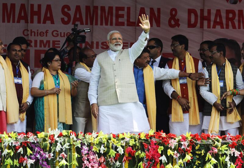 Indian Prime Minister Narendra Modi (C) waves during a public meeting at Thakurnagar area, some 75 kms northeast of Kolkata, in the Indian state of West Bengal on February 2, 2019.
  / AFP / STR
