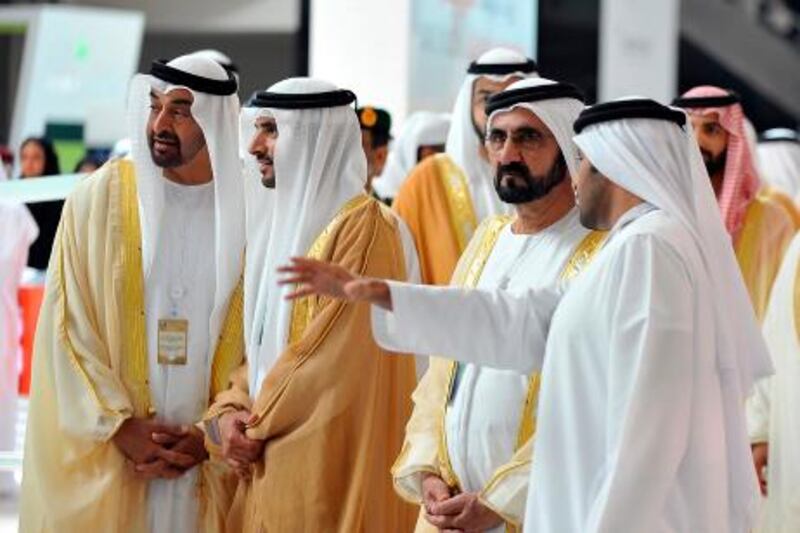 United Arab Emirates' Vice President and Prime Minister, and Ruler of Dubai, Sheikh Mohammed bin Rashid al-Maktoum (2nd R), Dubai's Crown Prince Sheikh Hamdan bin Mohammed bin Rashid al-Maktoum (2nd L) and Abu Dhabi's Crown Prince Sheikh Mohammed bin Zayed al-Nahayan (L) attend the International Defence Exhibition and Conference (IDEX) at the Abu Dhabi National Exhibition Centre February 17, 2013. REUTERS/Ben Job (UNITED ARAB EMIRATES - Tags: POLITICS ROYALS MILITARY) *** Local Caption ***  ABU01_ABU-DHABI-_0217_11.JPG