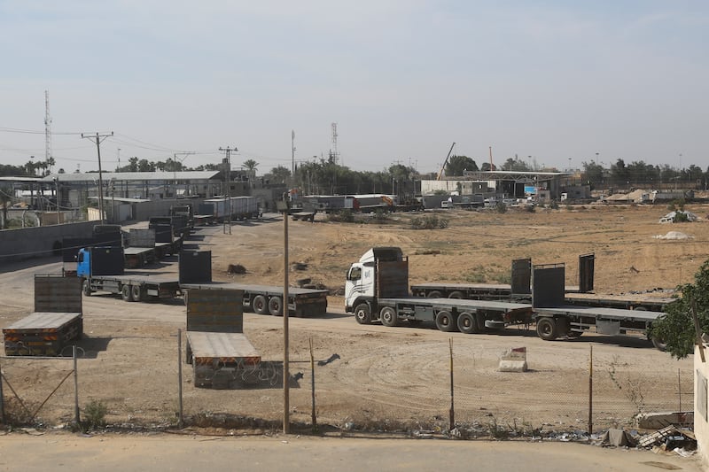 Palestinian lorries line up on the Gaza side of the border with Egypt to receive the aid. The Israeli blockade denied Gazans water, fuel and electricity as its military killed more than 4,000 Palestinians and displaced one million. AP